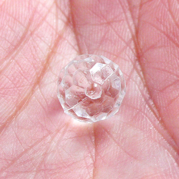 Bead, acrylic, transparent clear, 10mm faceted round. Sold per 100-gram  pkg, - Fire Mountain Gems and Beads