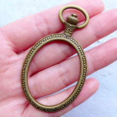 Oval Pocket Watch Open Back Bezel Charm | Outlined Pocketwatch Pendant | Hollow Deco Frame for UV Resin Filling | Epoxy Resin Jewelry Making (1 piece / Antique Bronze / 38mm x 66mm / 2 Sided)