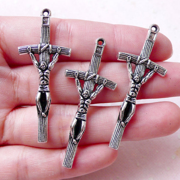 Crucifix charms deals
