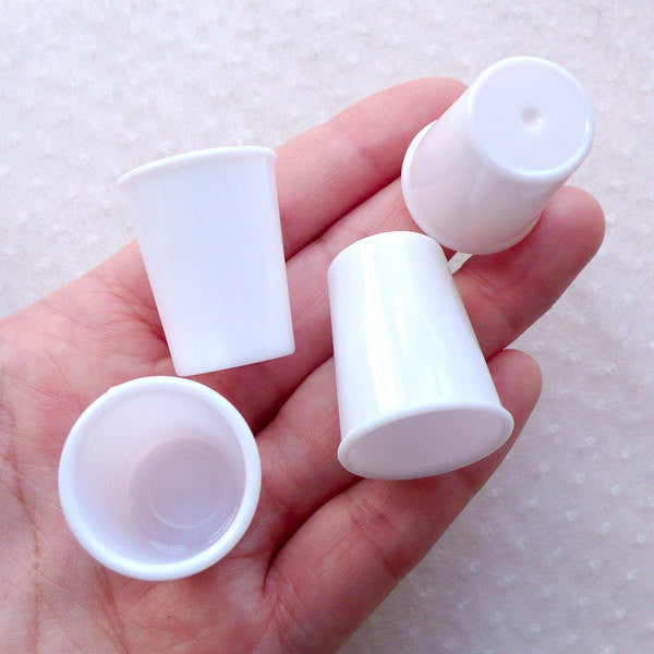 Small plastic coffee top cups