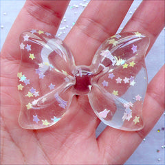 Transparent Bow Cabochon with Star Confetti | Large Bow Cabochon with Glitter Sprinkles | Kawaii Decoden Crafts | Resin Flatback | Fairy Kei Phone Case Decoration | Chunky Jewellery Making (1 piece / Clear / 54mm x 41mm / Flat Back)