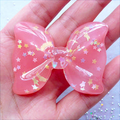 Big Bow Cabochon with Star Sprinkles | Translucent Resin Bow Cabochon with Confetti | Pastel Kei Decoden | Cell Phone Case Deco | Kawaii Chunky Jewelry Making (1 piece / Coral Pink / 54mm x 41mm / Flat Back)