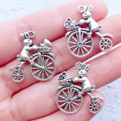 Rabbit on Bicycle Charms | Bunny on Bike Charm | White Rabbit Charms | Animal Pendant | Easter Decoration | Alice in Wonderland Jewellery (3pcs / Tibetan Silver / 21mm x 23mm / 2 Sided)